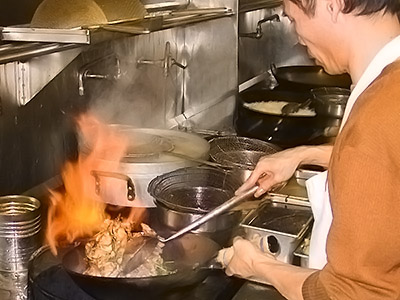 Mr. Chan cooks a stir fry